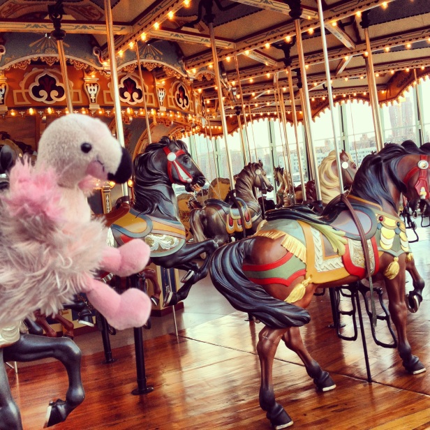 Mr. Stilts joins the horses at Jane's Carousel in Brooklyn Bridge Park.