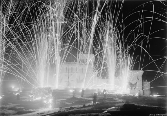 An ice palace and fireworks at Saranac Lake in the early 1900s. Click for photo source. 