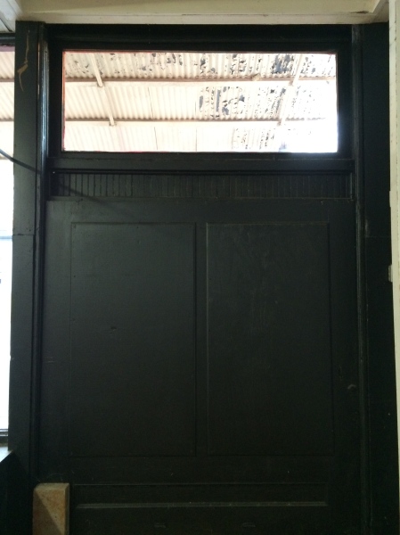 The interior corner, a door. 